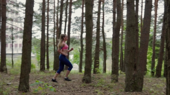 Woman Running in the Forest