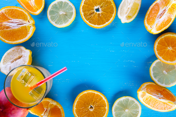 Fresh sliced fruit on a wooden blue background - Stock Photo - Images