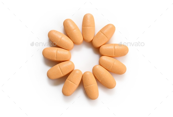 orange pills over white - Stock Photo - Images