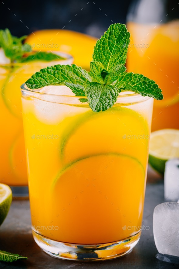 Fresh summer mango juice with lime and mint