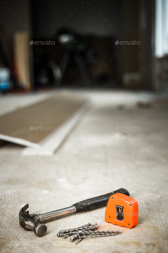Hammer, Nails and Orange Measuring tape