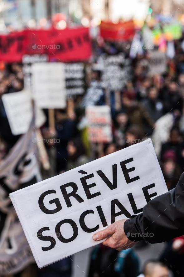 Someone Holding a Sigh Saying "Greve Sociale" (French) with Blu - Stock Photo - Images