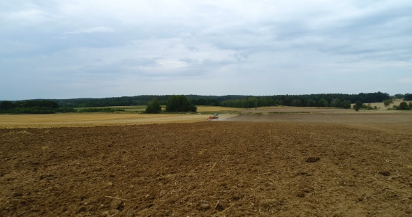 Agricultural Tractor Plowing Field alt