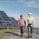 Workers Walking in Between Rows of Solar Panels - VideoHive Item for Sale