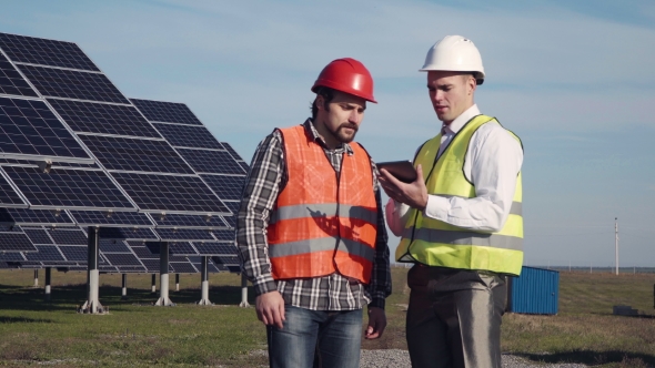Two Engineers with Tablet. alt