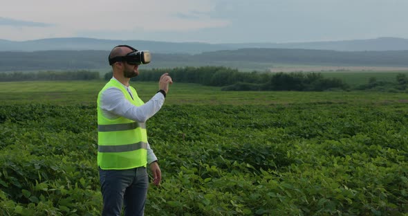 Farm Specialist Engineer Using Technology VR Monitoring Harvest Working for Agriculture Productivity alt