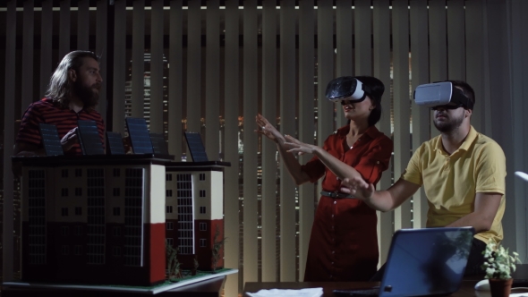 People with VR Helmets in Office alt