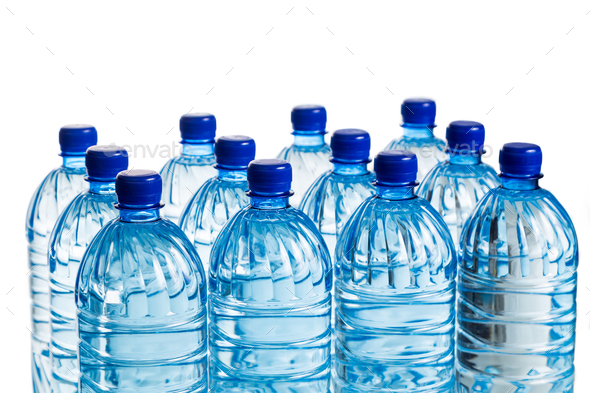 Closeup on rows of mineral water in plastic bottle Stock Photo by ThamKC