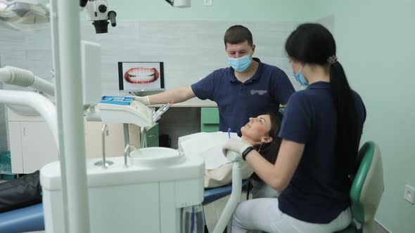 Professional Dentist Working With Gloves With Patients Teeth