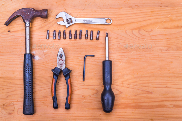 Essential basic tools set consisting hammer, plier, screwdriver,