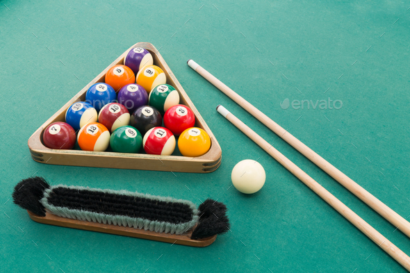 Snooker billards pool balls, cue, brush, chalk on green table