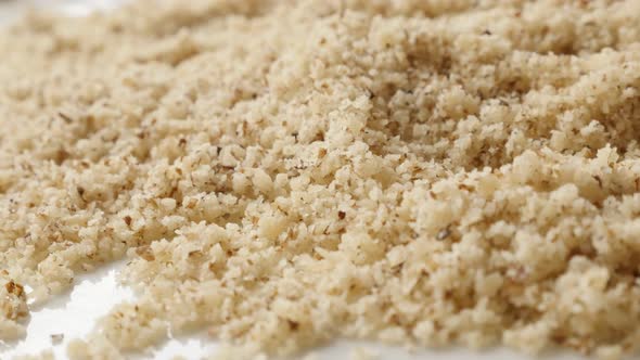 Slow pan   healthy food background of grinded nuts shallow DOF  4K 2160p 30fps UltraHD  footage - Pi alt