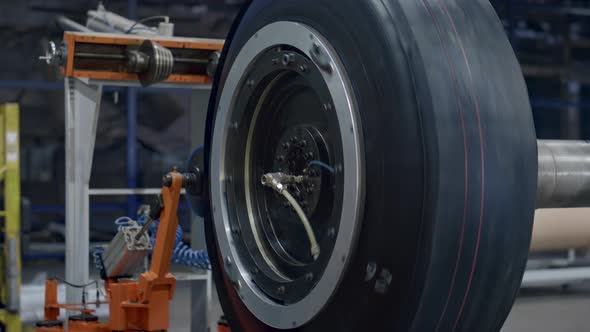 Tyre Production Machine Rotating with New Car Rubber Tire at Industrial Factory alt