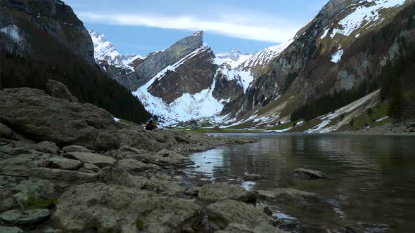 Snow Capped Mountains In The Spring On The Seealpsee In Switzerland alt