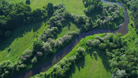 Flight Over River in Meadows