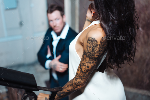 Beautiful, young couple posing on camera indoors - Stock Photo - Images