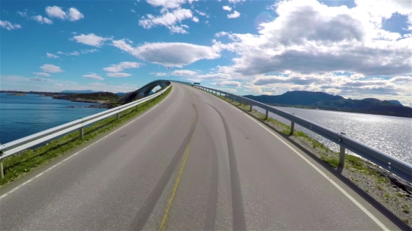 Driving a Car on a Road in Norway Atlantic Ocean Road or the Atlantic Road alt