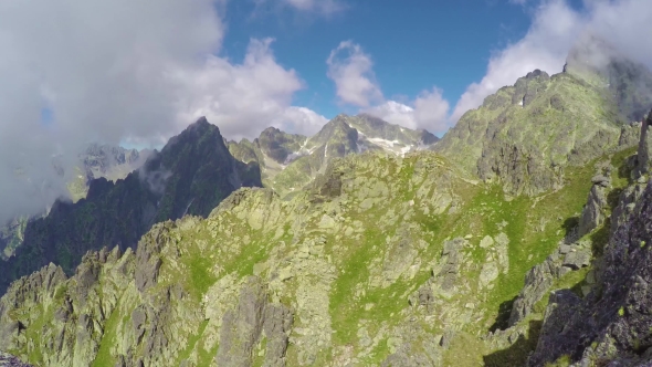 View of Clouds Moving Over Mountains