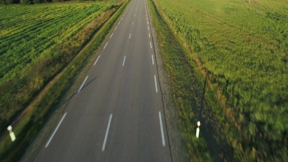 Flying Above Road in Fields