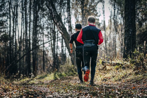 Two men running woods