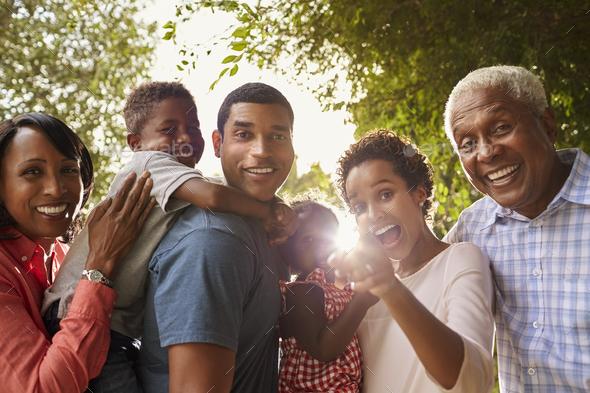 Multi generation black family in garden look to camera Stock Photo by ...