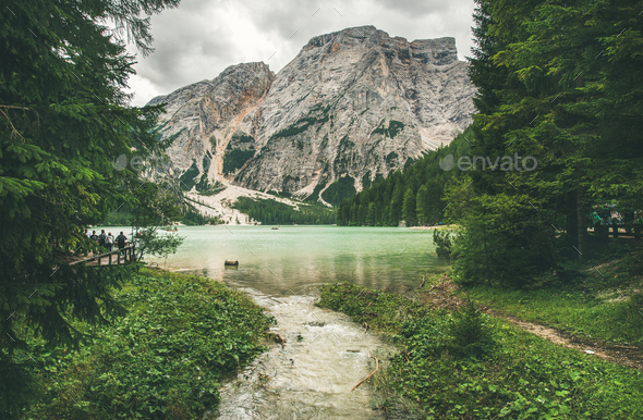 Mountain Lake in Valle di Braies surrounded by forests - Stock Photo - Images