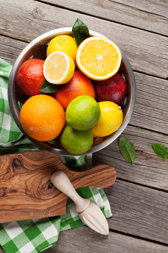 Fresh citrus fruits in colander Stock Photo by karandaev PhotoDune