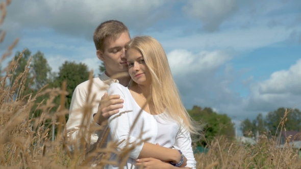 Young Couple on Date in Wheat Field alt