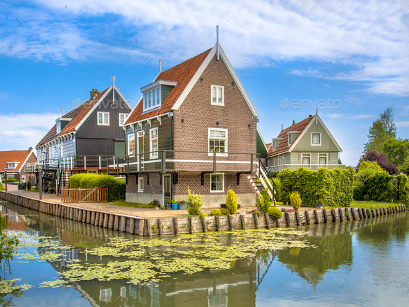Historic waterfront houses along canal - Stock Photo - Images