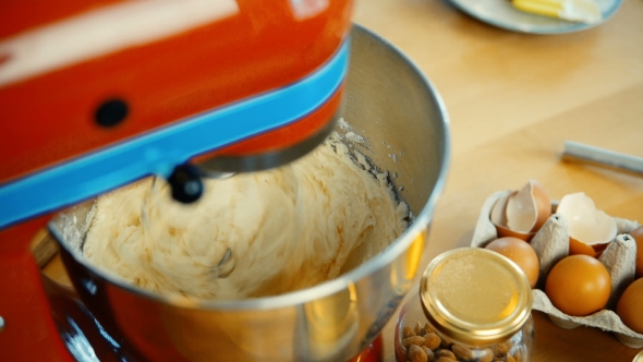View of Red Mixer Blending the Dough, Ingredients in Big Bowl Confectioner Cooking the Desserts alt