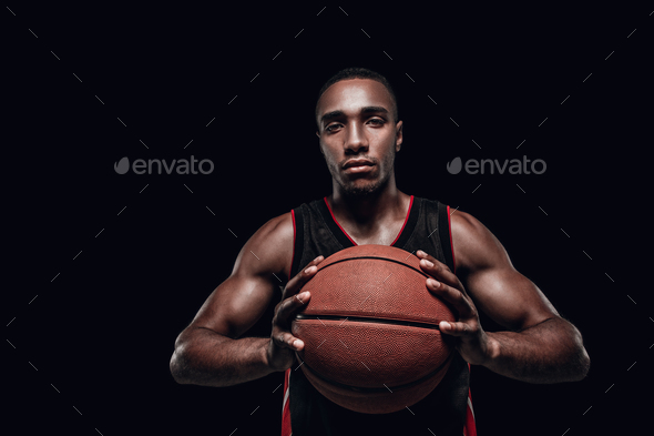 The portrait of a basketball player with ball - Stock Photo - Images