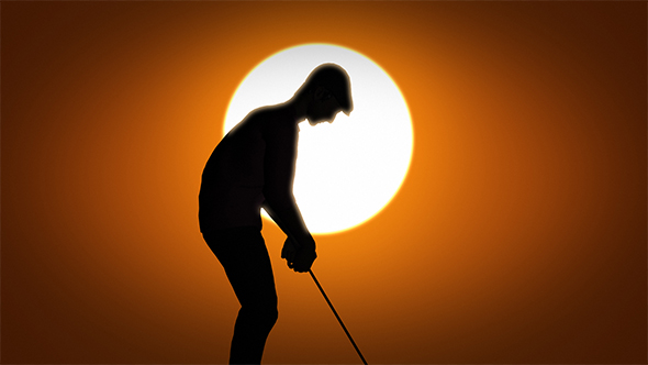 Male Caucasian Golfer In Sunset Silhouette
