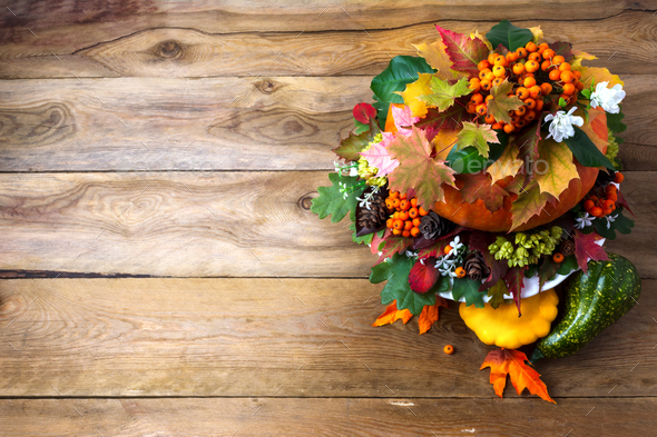 Thanksgiving table centerpiece with autumn leaves on the rustic Stock ...