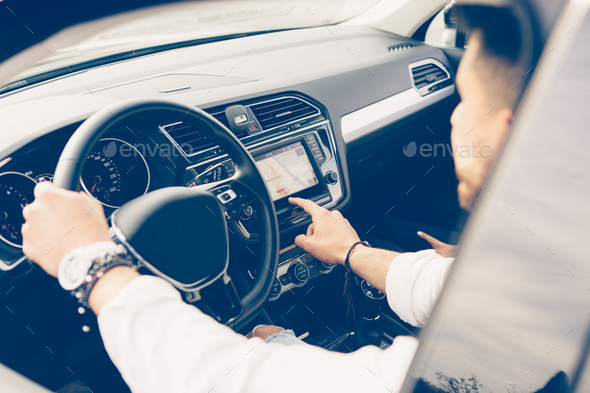 Man uses automotive navigation system