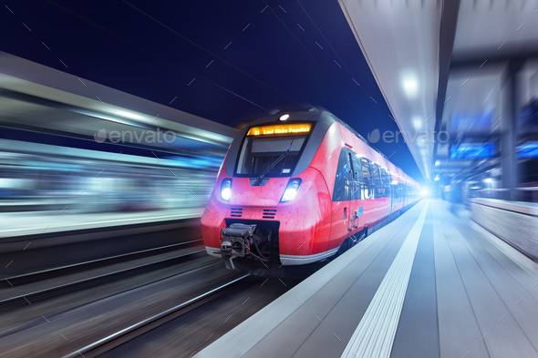 Modern high speed red passenger train at night - Stock Photo - Images