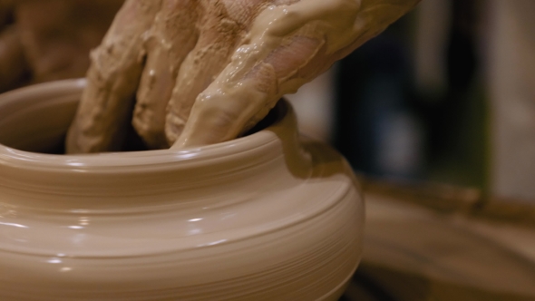 Potter Is Making Clay Pot on the Potter's Wheel