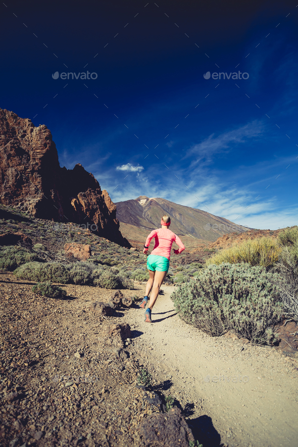 Trail running girl in mountains, inspiration and motivation