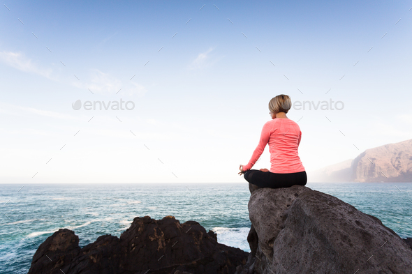 Yoga Girl Meditating And Relaxing In Yoga Pose Ocean View Stock Photo By Blas