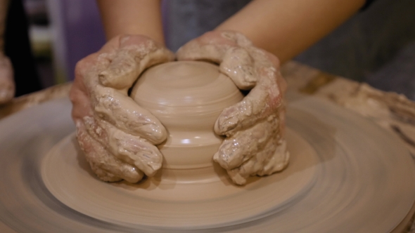 Potter Is Making Clay Pot on the Potter's Wheel
