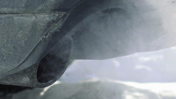 Car Pipe Puffs Out Exhaust Gas alt