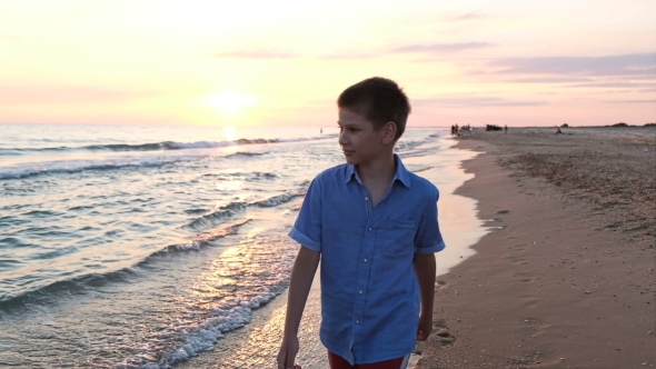Boy Walk Along the Beach