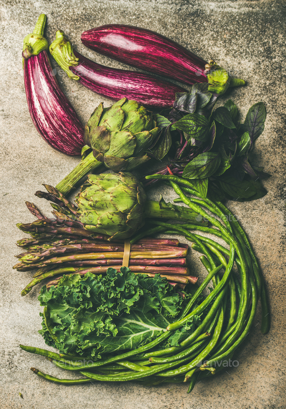 Flat-lay of fresh green and purple vegetables - Stock Photo - Images