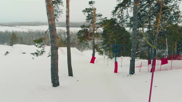 Motion Along Automatic Surface Lift at Ski Resort on Hill alt