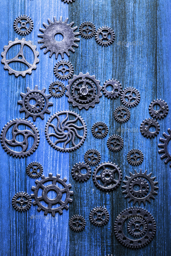 steampunk mechanical cogs gears wheels on blue background