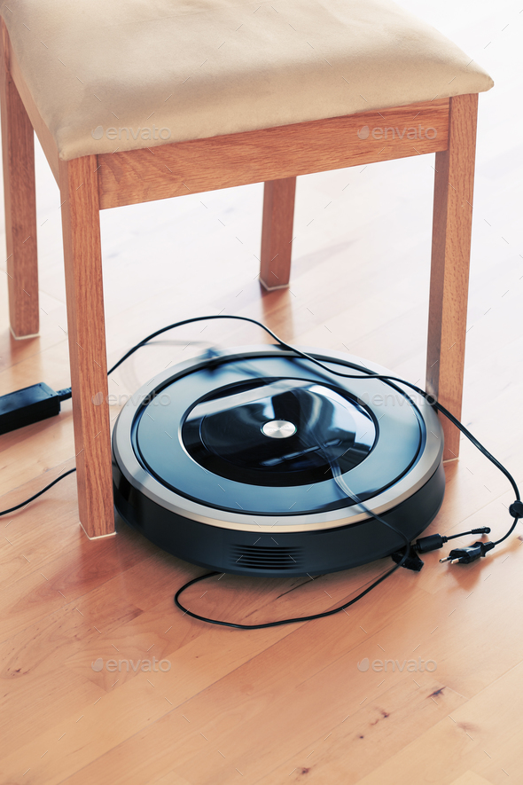 robotic vacuum cleaner on laminate wood floor smart cleaning tec