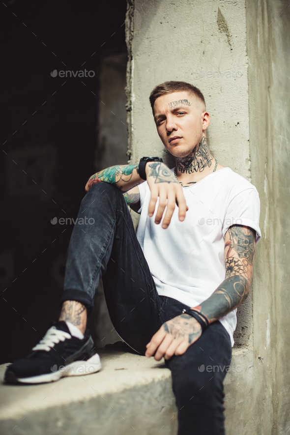 Handsome young fashion model posing on city streets.Outdoor fashion  portrait, stylish man in elegant coat. Lifestyle concept. Stock Photo |  Adobe Stock