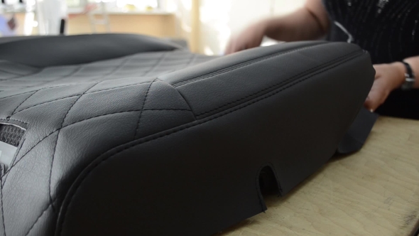 Woman Puts Car Seat Cover on Car Seat