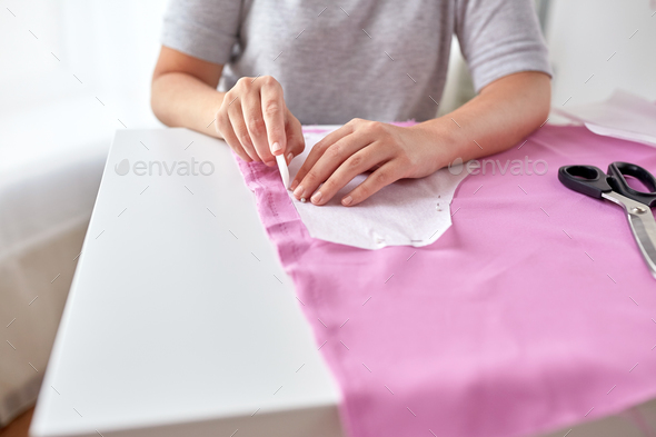 woman with pattern and chalk drawing on fabric