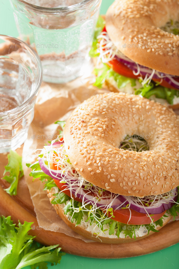 tomato sandwich on bagel with cream cheese onion lettuce alfalfa Stock Photo by duskbabe