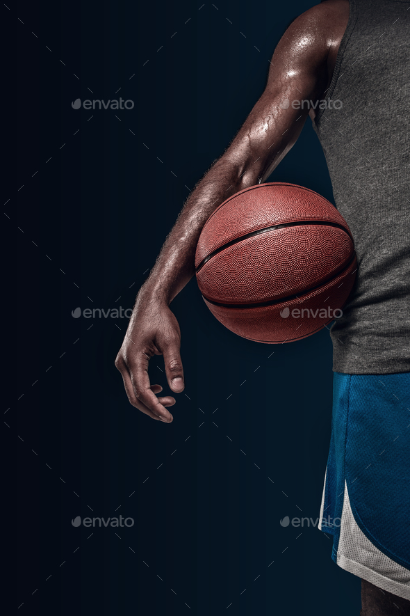 The hands of a basketball player with ball Stock Photo by master1305